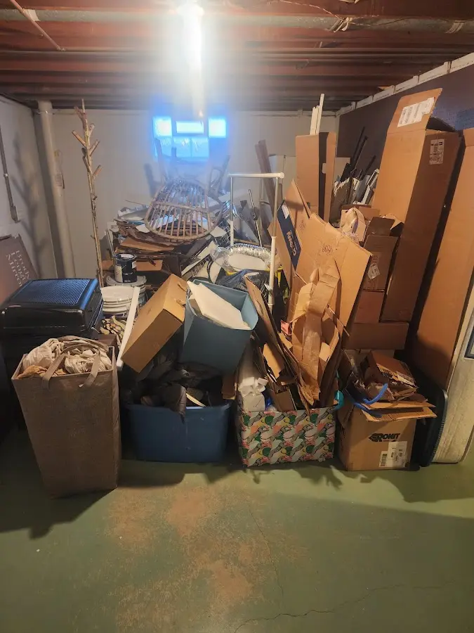 Roll-off dumpster container at job site for 2 Yard Dumpster Rental in Oak Hills